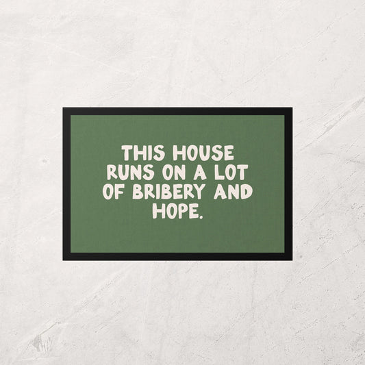 Green sign with white text on a textured wall